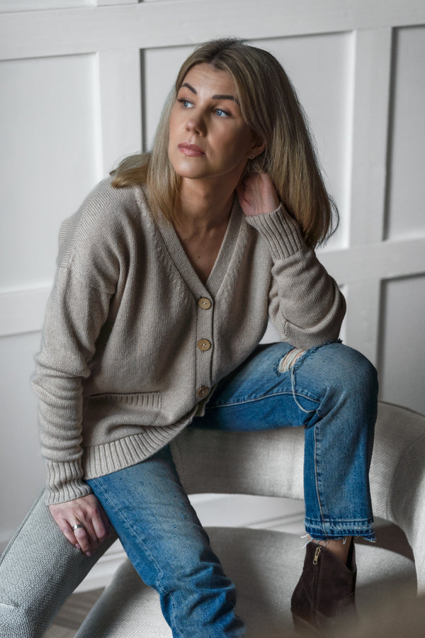 Beige button-up cardigan with a V-neck